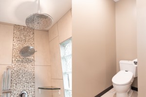 Luxury rainfall shower heads in a tiled walk-in shower