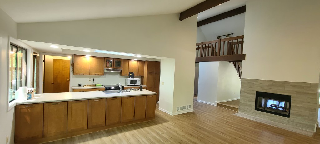 Interior view of home with structural beam repair and drywall patching in Akron