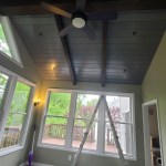 Newly built four-season sunroom with vaulted ceiling and wide windows