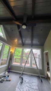 Newly built four-season sunroom with vaulted ceiling and wide windows
