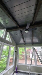 Vaulted ceiling sunroom under construction with expansive outdoor view