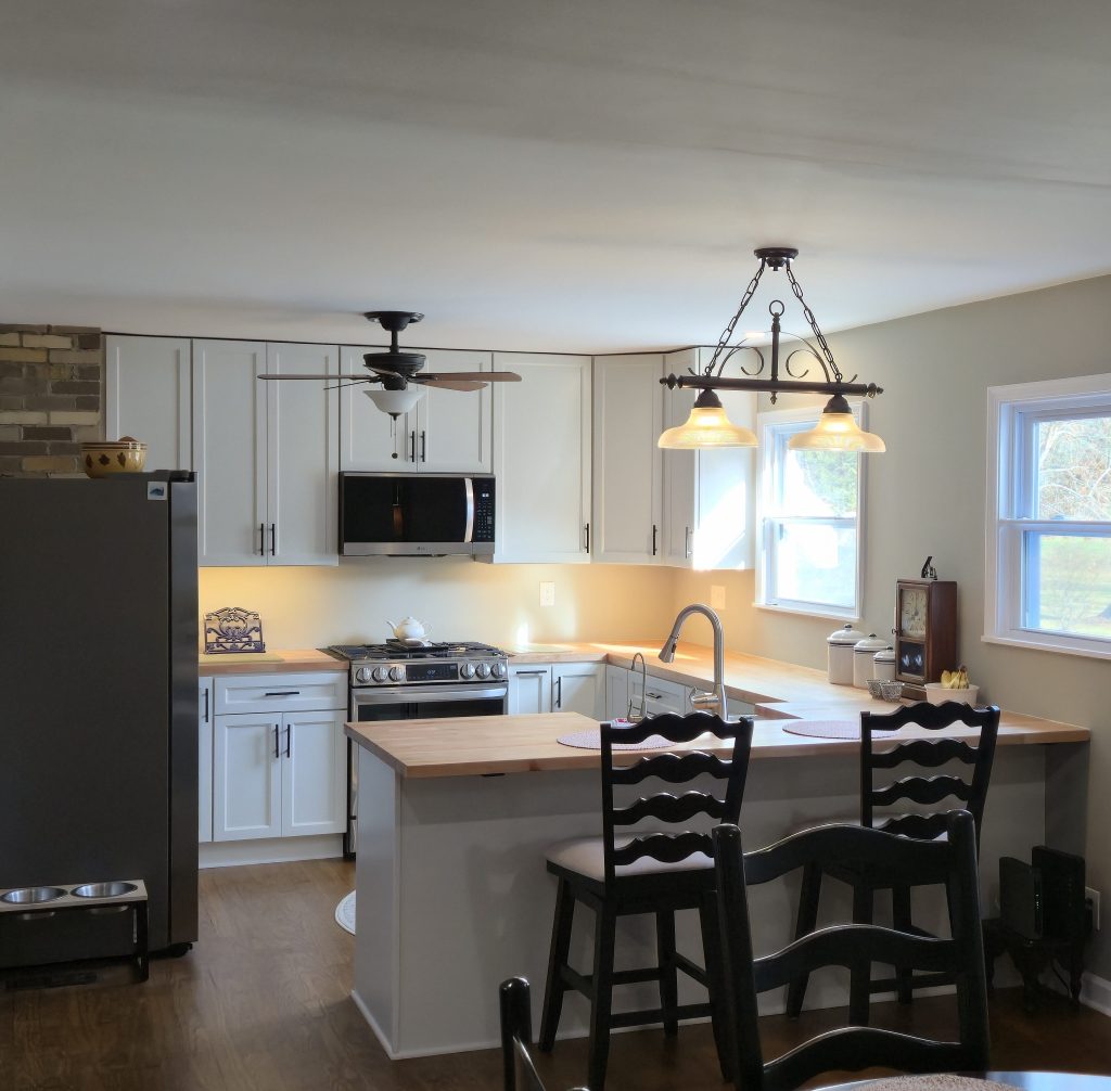 Open kitchen and dining remodel with new floors, updated paint, and full layout redesign.