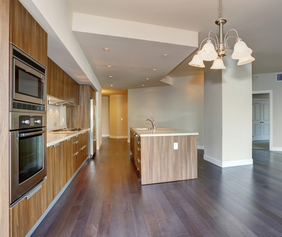 Open concept kitchen remodel with wood cabinets, large island, and modern layout