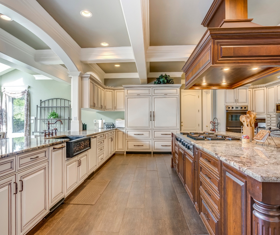 Luxury kitchen remodel with custom cabinetry, large island, and coffered ceiling