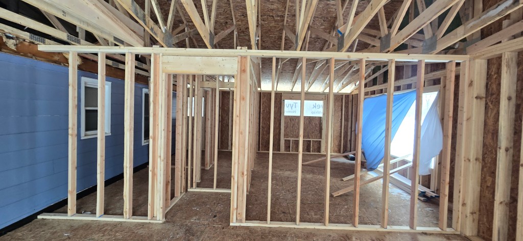 New interior wall framing inside a residential home addition in North Royalton, Ohio before electrical and drywall installation.