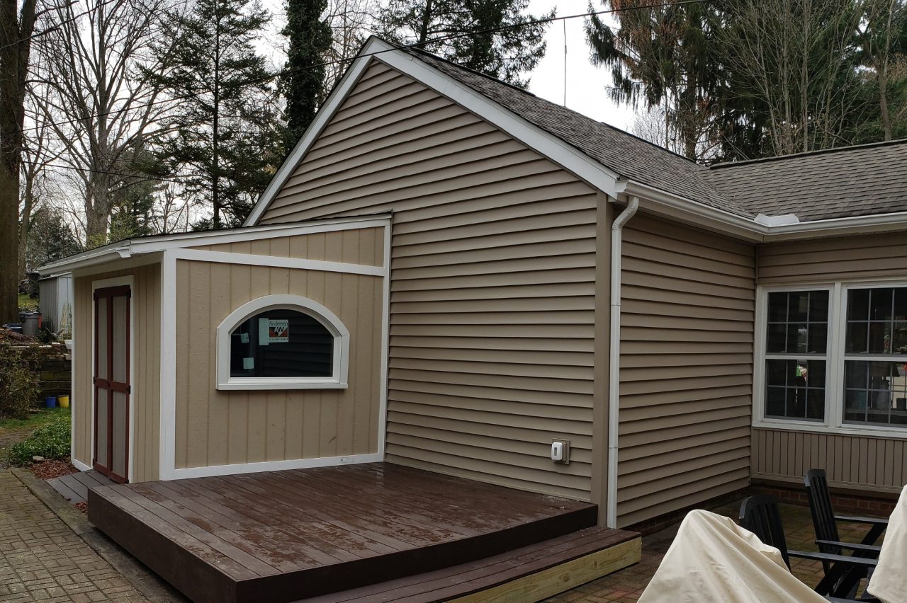 Akron home restoration after water and fire damage with new siding and trim